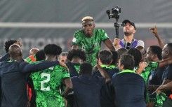 Victor Osimhen (C) and teammates celebrate after Nigeria reached the Africa Cup of Nations final.
