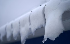 Snow melts on the roof of an ice fishing cabin in Sainte-Anne-de-la-Perade, Quebec, Canada in January 2024