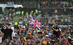 F1 fans watch the podium ceremony for the British Grand Prix at Silverstone