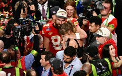 US singer-songwriter Taylor Swift and Kansas City Chiefs' tight end Travis Kelce embrace after the Chiefs' Super Bowl victory over the San Francisco 49ers