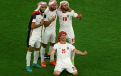 Jordan's players celebrate after defeating South Korea 