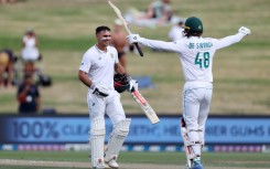 South Africa's David Bedingham (left) is congratulated after reaching his hundred by Ruan de Swardt