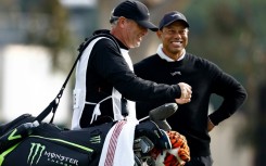 Golf superstar Tiger Woods enjoys a laugh with his caddie Lance Bennett during the pre-tournament pro-am at the US PGA Tour Genesis Invitational at The Riviera Country Club