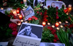 Flowers and candles left at a memorial to Navalny outside the Russian embassy in Berlin