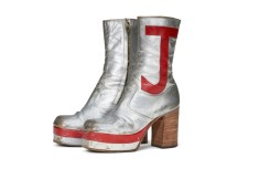 Elton John's monogrammed silver leather boots sold for nearly $100,00 at auction in New York
