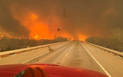 A US nuclear weapons plant said it would be open as usual after pausing operations due to wildfires near Amarillo, Texas