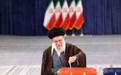 Supreme leader Ayatollah Ali Khamenei casts his ballot, appealing for citizens to do the same because Iran's 'enemies want to see if the people are present'