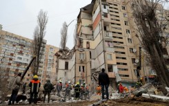 More than 90 rescuers were working to pull people from the rubble in Odesa, Ukraine's emergency services said