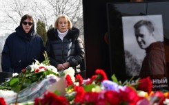 Lyudmila Navalnaya (L) visited her son's grave at the Borisovo cemetery in southern Moscow