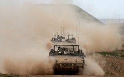 Israeli army vehicles rolling out of Gaza on March 3, 2024, amid the ongoing battles between Israel and Hamas