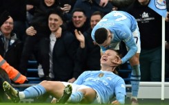 Erling Haaland (centre) and Phil Foden (right) scored in Manchester City's 3-1 win over Manchester United