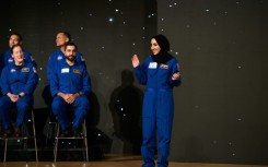 Nora Al Matrooshi (R) waves during the graduation ceremony for NASA Artemis astronaut candidates at Johnson Space Center in Houston, Texas, on March 5, 2024 