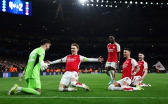 Arsenal celebrate their penalty shootout win over Porto in the Champions League last 16