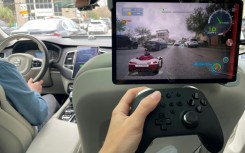 A journalist tests extended reality video game Valeo Racer