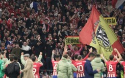 Atletico Madrid's players celebrate victory over Inter Milan in Madrid