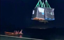 Aid from the Open Arms vessel being unloaded onto the shore of the besieged Gaza Strip