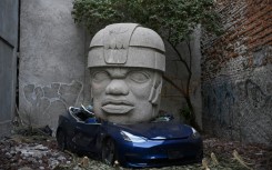 This Tesla 3 car crushed by a nine-ton Olmec-inspired head is the doing of Mexican artist Chavis Marmol