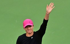 Poland's Iga Swiatek acknowledges the fans after defeating Ukraine's Marta Kostyuk in the semi-finals of the ATP-WTA Indian Wells Masters