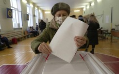 Russia votes in election set to hand Putin six more years