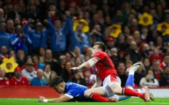 Excellent score: Italy full-back Lorenzo Pani (under L) dives across the line to score a try in a xx-x Six Nations win over Wales in Cardiff