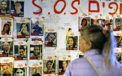 Pictures of hostages held by Palestinian militants in the Gaza Strip since the October 7 attacks, displayed outside the Tel Aviv Museum of Art