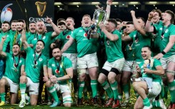 Champions: Ireland captain Peter O'Mahony lifts the Six Nations trophy after a 17-13 win over Scotland in Dublin