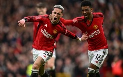 Manchester United's Brazilian midfielder  Antony (L) celebrates with Amad Diallo (R)