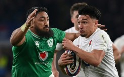 Bundee Aki (L) tackles Marcus Smith during Ireland's narrow defeat by England at Twickenham in the Six Nations