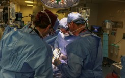 Surgeons at Massachusetts General Hospital performing the world's pig kidney transplant into a living human