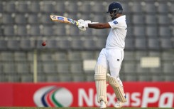 Sri Lanka's Dimuth Karunaratne held firm to score 52 off 101 balls before his dismissal off Shoriful Islam in the day's final session