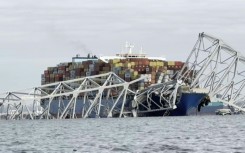 Images of collapsed Baltimore bridge and container ship