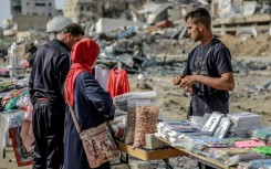 A vendor among the destruction of Gaza City -- the International Court of Justice said 'famine is setting in'