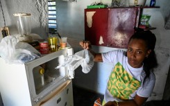 Diana Ruiz and her nearly empty refrigerator, photographed in Havana on March 27, 2024 