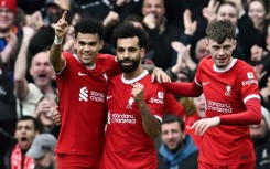 Liverpool's Mohamed Salah (C) celebrates after against Brighton