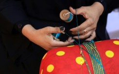 The art of hand-weaving braided shiny ribbons to adorn traditional clothing and bags is called Al Talli, and is on UNESCO's Intangible Cultural Heritage of Humanity list