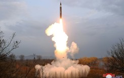 North Korea's official Korean Central News Agency shows the first test-fire of a new-type intermediate-range solid-fueled ballistic missile