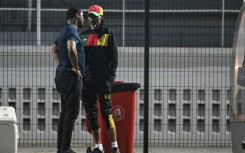 Cameroon football federation president Samuel Eto'o (L) talks to former coach Rigobert Song during an AFCON training session