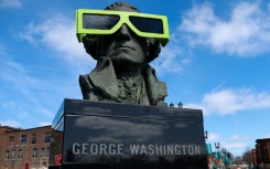 Eclipse glasses are worn by a statue of George Washington on April 07, 2024, in Houlton, Maine