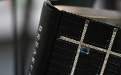 The one of a kind volume is signed by the author and decorated with almost 30 carats of diamonds