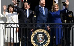 (L-R) Yuko Kishida, her husband Japanese Prime Minister Fumio Kishida, US President Joe Biden and First Lady Jill Biden wave from the Truman Balcony during an Official Arrival Ceremony on the South Lawn of the White House in Washington, DC, April 10, 2024.