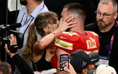 Taylor Swift, shown here kissing Travis Kelce at the 2024 Super Bowl, was spotted at Coachella similarly canoodling with her NFL boyfriend during the set of Bleachers, which is fronted by her producer