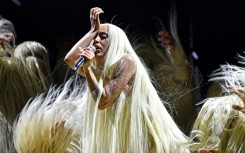 US singer Doja Cat's weird, sexy exclamation point of a performance was the crown jewel of a day that capped a weekend of powerful sets from stage-commanding women at the Coachella Valley Music and Arts Festival in Indio, California