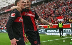Florian Wirtz (L) and Granit Xhaka (R) will be staying with new Bundesliga champions Bayer Leverkusen next season