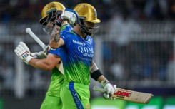 Angry: Virat Kohli (R) walks back to the pavilion after his controversial dismissal 