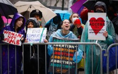 Pro abortion rights activists hold placards during the annual anti-abortion demonstration in New York City, on March 23, 2024