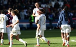 Selma Bacha and Melchie Dumornay, Lyon's two goal-scorers, celebrate together after their team beat French rivals Paris Saint-Germain to reach the Women's Champions League final