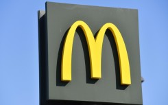 Although profits edged higher, McDonald's executives pointed to a continued drag in sales due to a boycott in the Middle East