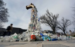 A sculpture titled "Giant Plastic Tap" by Canadian artist Benjamin Von Wong is displayed outside the fourth session of the UN Intergovernmental Negotiating Committee on Plastic Pollution that has wrapped up in Ottawa, Canada