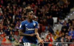 Athletic Bilbao's Spanish forward Nico Williams shows his skin colour as he celebrates scoring against Atletico Madrid on April 27
