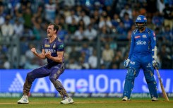 Kolkata Knight Riders' Mitchell Starc (L) celebrates after his team's win against Mumbai Indians in the IPL